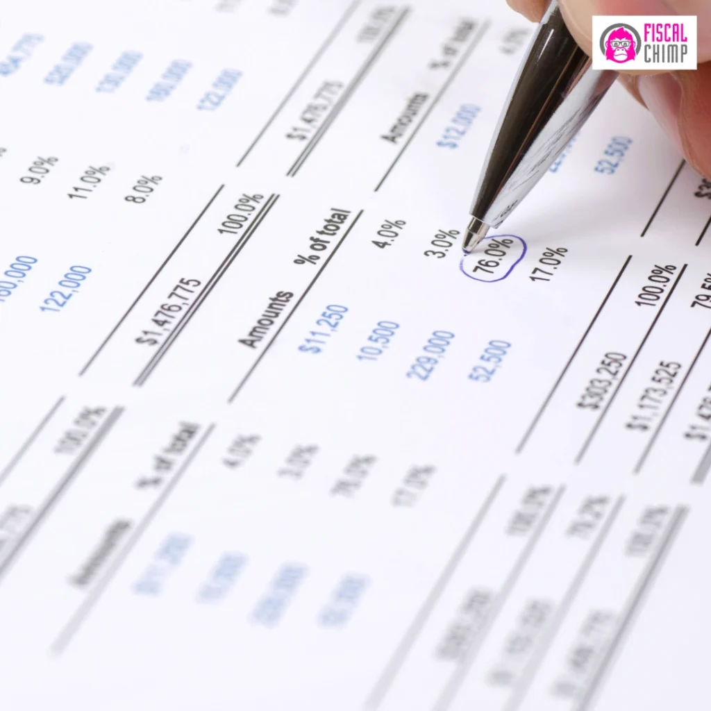 Close-up of a hand with a pen circling 76.0% on a financial form, showing 'Amounts' and '% of total' columns.