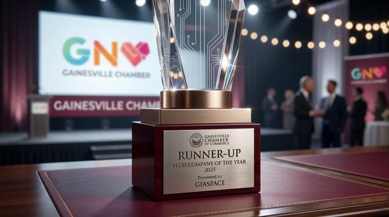 Trophy for Runner-Up Tech Company of the Year 2025 at the Gainesville Chamber, awarded to GIASPACE on a wooden pedestal with a metal plaque.