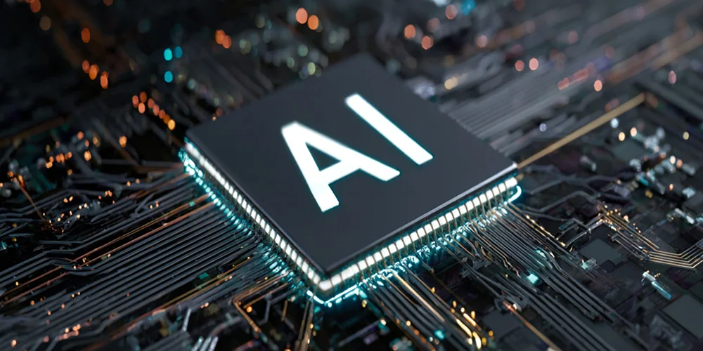 Close-up of a microchip labeled AI on a glowing circuit board edge, highlighting advanced hardware.